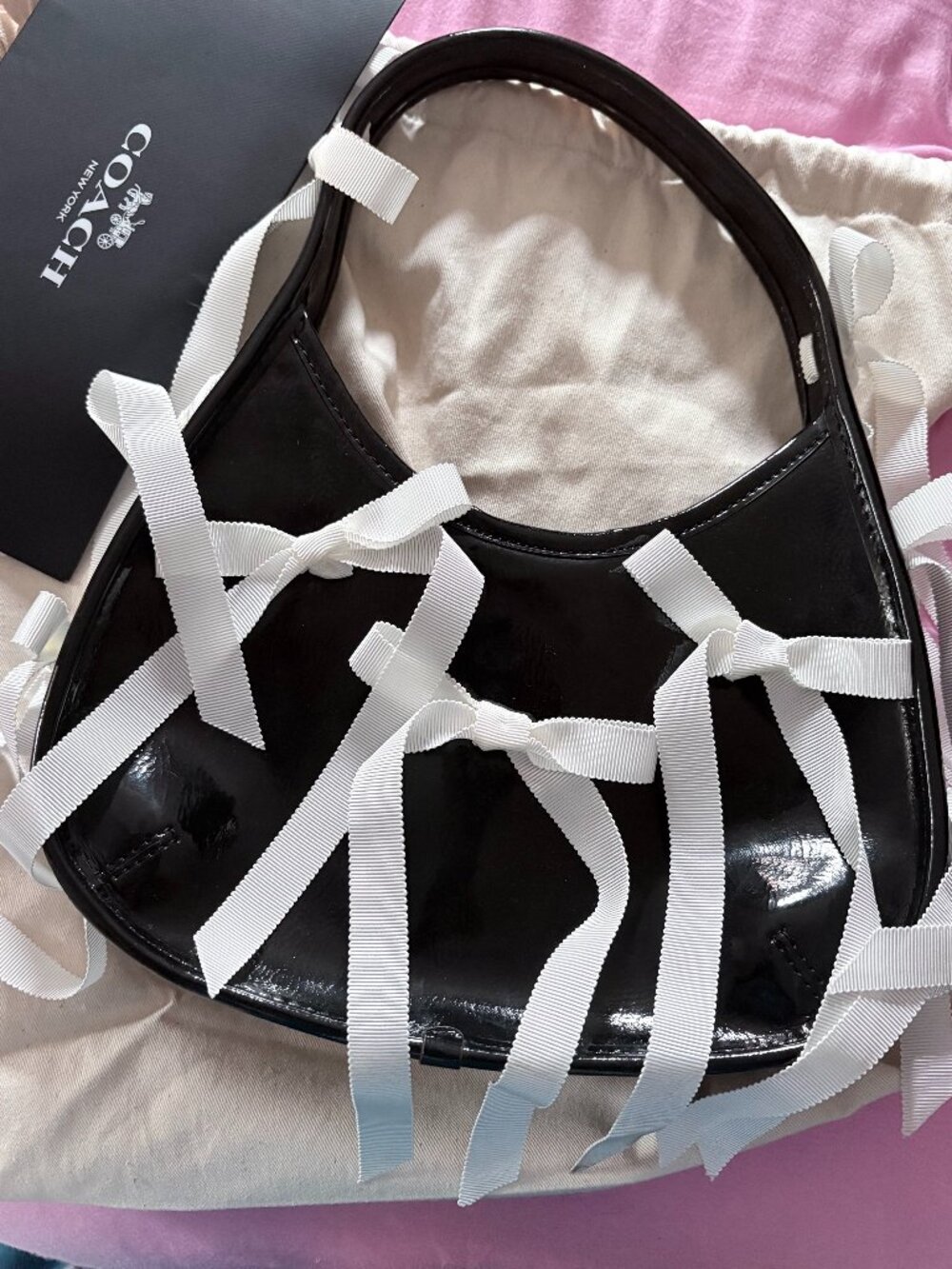 Coachtopia Ergo shoulder bag in black patent with bows and ribbons